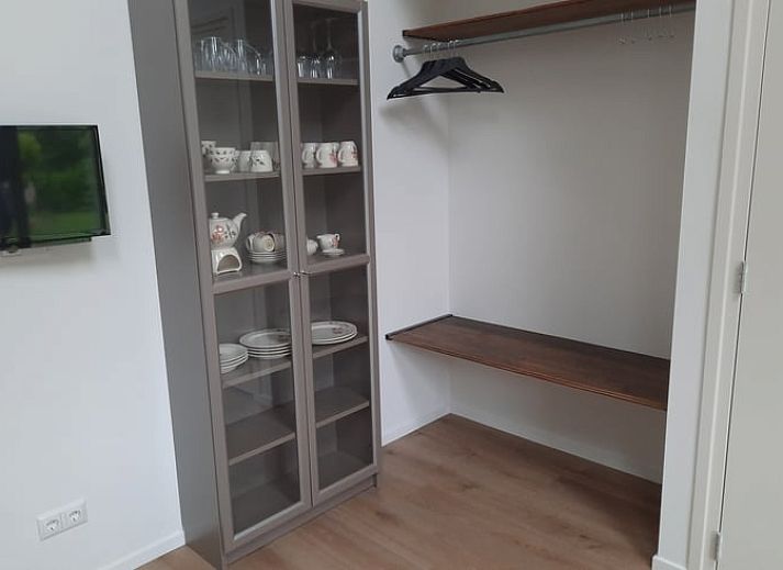 Cozy bedroom in Holiday Home in Smilde, Central Drenthe with art on the wall.