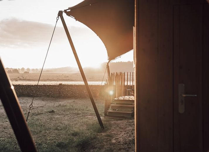 Stijlvolle binnenruimte van Vakantiehuis in Odoorn, Midden Drenthe, met moderne inrichting en comfortabele zitplekken.