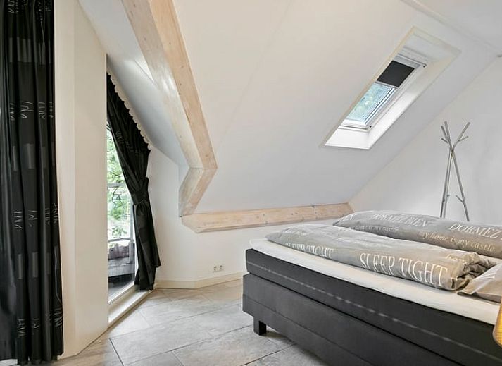 Vakantiehuisje in Norg, Noord Drenthe verscholen in het bosrijke landschap.