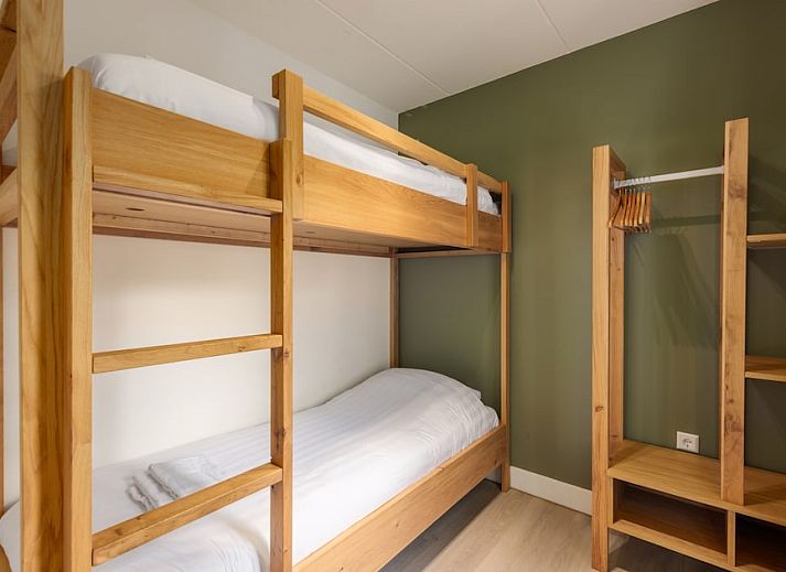 Cozy living room in H6A Comfort bungalow, Borger, North Drenthe, overlooking terrace and green nature.