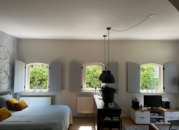 Attractive bedroom in Cottage in Tynaarlo, North Drenthe, with comfortable double bed and natural decoration.