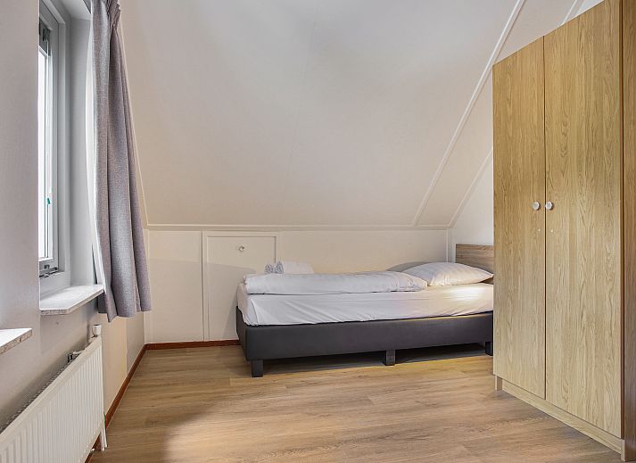 Gezellige zithoek met open haard in Het Land van Bartje 6-persoons landhuis, Ees, Noord Drenthe.