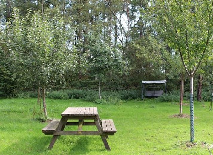 Sliding glass doors at Holiday Home in Nietap, North Drenthe, offer views of expansive fields.