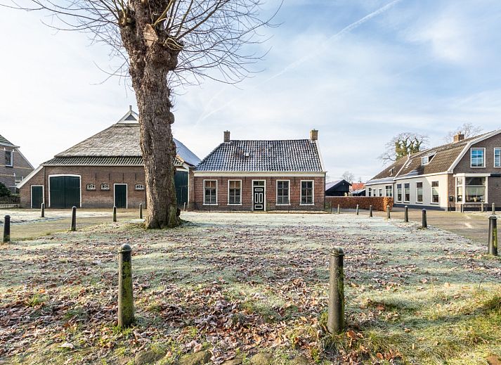 Gemuetliches Wohnzimmer im Ferienhaus DG984, Vries, Drenthe, mit komfortabler Sitzecke.