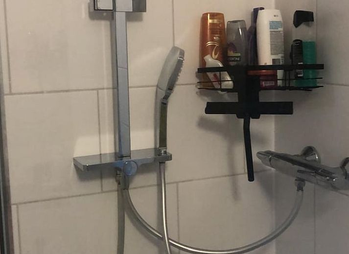 Cozy terrace at Cottage in Matsloot, vacation home in North Drenthe with comfortable seating.