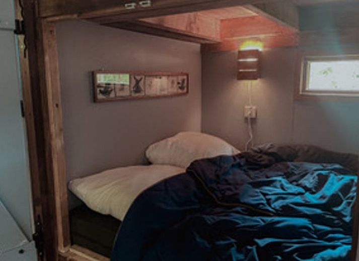 Houtkachel in Vakantiehuis in Drouwenerveen, Noord Drenthe, creeert een warme sfeer.