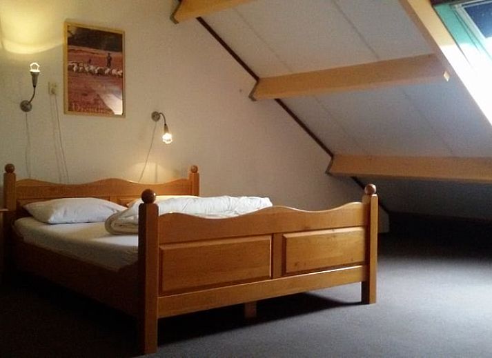 Gezellige eetruimte in Vakantiehuis in Meppen, Zuidoost Drenthe, met uitzicht op de groene omgeving.