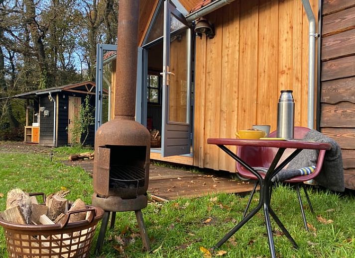 Charmanter Aussenbereich des Ferienhauses in Meppen mit Terrasse und Sitzbereich, ideal zum Entspannen.