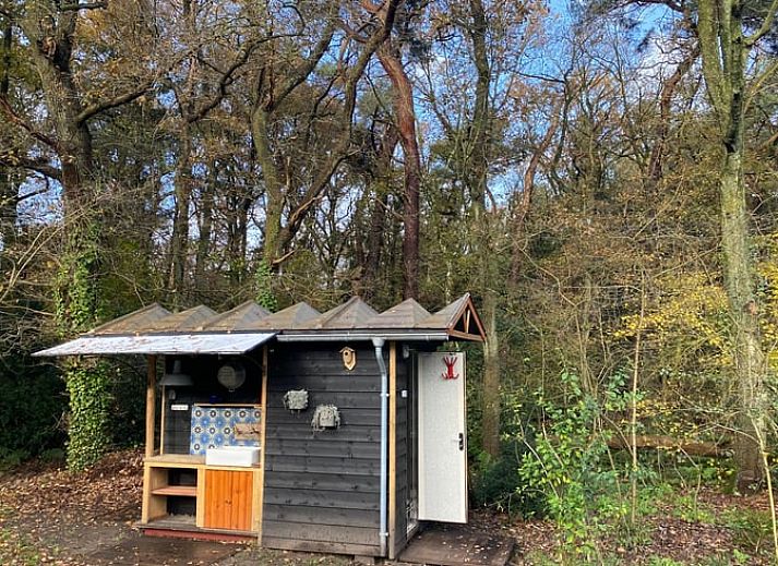 Charmanter Aussenbereich des Ferienhauses in Meppen mit Terrasse und Sitzbereich, ideal zum Entspannen.
