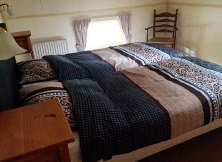 Vakantiehuis in Aalden, gezellige tuin met zitje bij vakantiehuis in Zuidoost Drenthe, Drenthe.