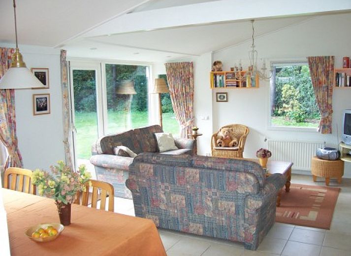 Clean holiday bungalow in Exloo, Drenthe with green garden and terrace for a relaxing stay.