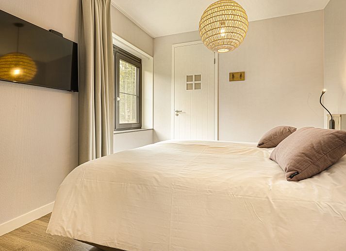 Gemuetliches Wohnzimmer im Ferienhaus PUUR Exloo, Exloo, Drenthe, ideal fuer entspannte Abende.