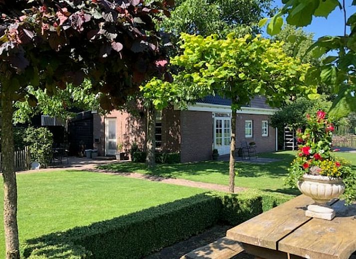 Vacation home in Exloo, Southeast Drenthe, with sunny terrace and green garden.