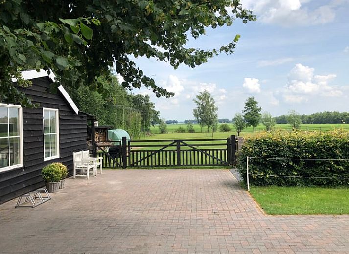 Vacation home in Exloo, Southeast Drenthe, with sunny terrace and green garden.