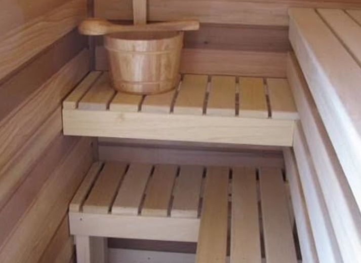 Cozy garden at Holiday Home in Exloo, Drenthe, with picnic table and flowering plants.