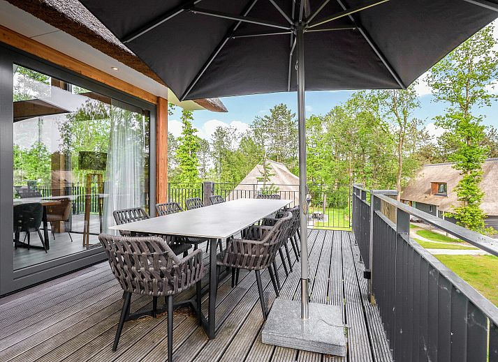 Gezellige zithoek in PUUR Exloo vakantiehuis in Exloo, ideaal voor ontspanning.