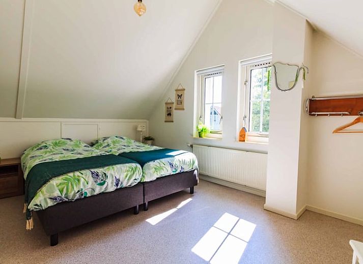 Cozy living room of Cottage in Exloo overlooking the garden in Exloo, Southeast Drenthe, Drenthe.