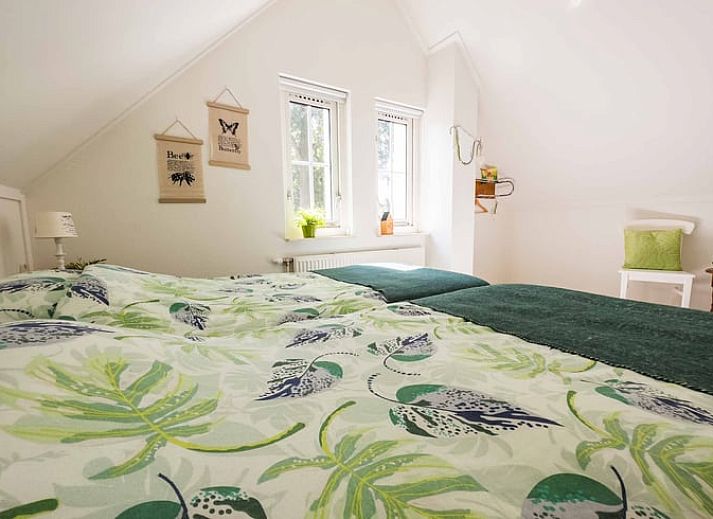 Cozy living room of Cottage in Exloo overlooking the garden in Exloo, Southeast Drenthe, Drenthe.