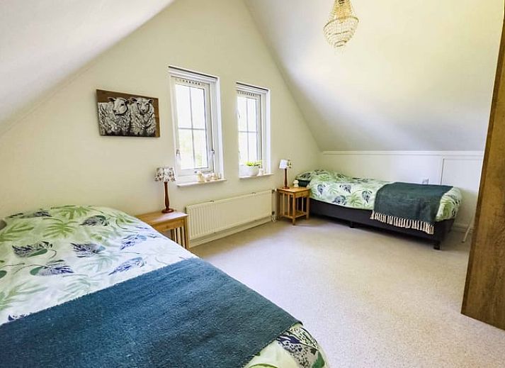 Cozy living room of Cottage in Exloo overlooking the garden in Exloo, Southeast Drenthe, Drenthe.