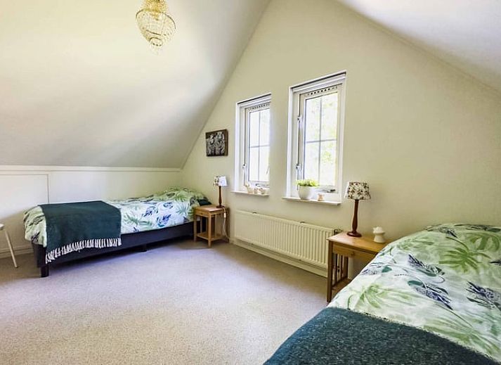 Cozy living room of Cottage in Exloo overlooking the garden in Exloo, Southeast Drenthe, Drenthe.