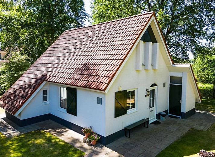 Cozy living room of Cottage in Exloo overlooking the garden in Exloo, Southeast Drenthe, Drenthe.