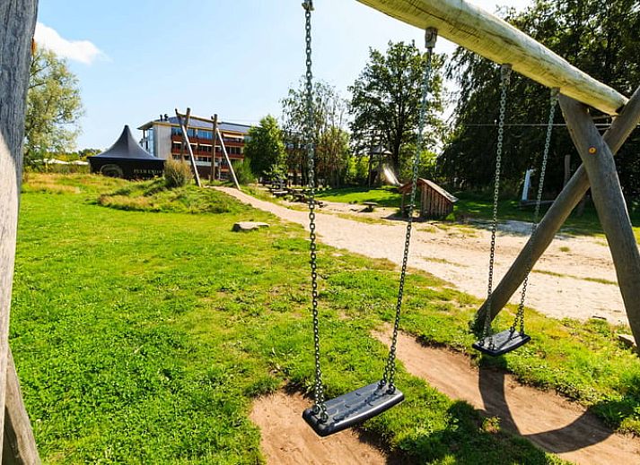 Covered table in the kitchen of Huisje in Exloo, attractive vacation home in Exloo, Southeast Drenthe, Drenthe.