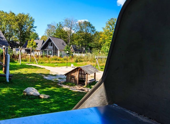 Covered table in the kitchen of Huisje in Exloo, attractive vacation home in Exloo, Southeast Drenthe, Drenthe.
