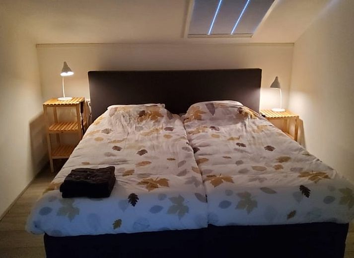 Gemuetliches Wohnzimmer in Cottage in Exloo, Ferienhaus in Drenthe mit komfortabler Sitzecke.