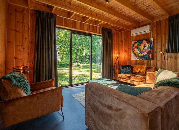 Relax on the terrace of Holiday Home in Dalerveen, Southeast Drenthe with comfortable lounge chairs and a luxurious Jacuzzi.