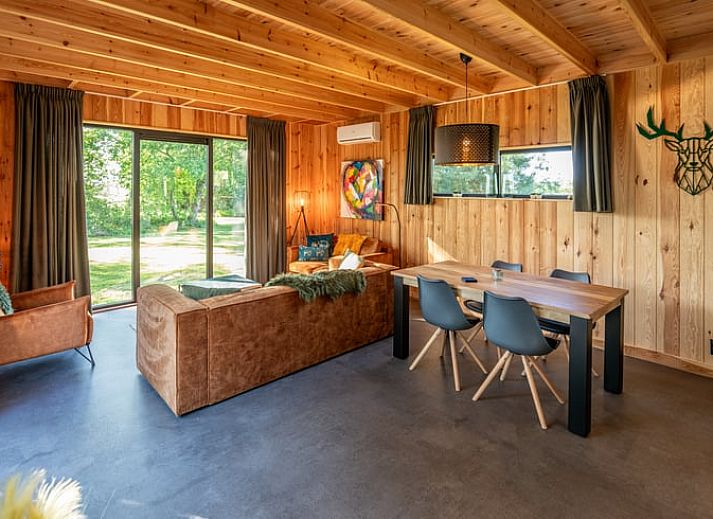Relax on the terrace of Holiday Home in Dalerveen, Southeast Drenthe with comfortable lounge chairs and a luxurious Jacuzzi.