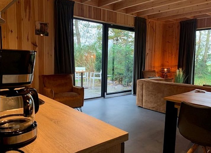 Relax on the terrace of Holiday Home in Dalerveen, Southeast Drenthe with comfortable lounge chairs and a luxurious Jacuzzi.