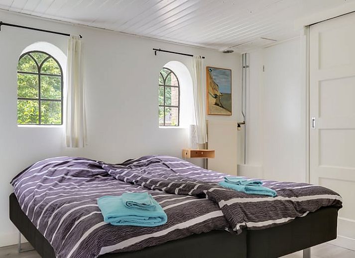 Authentieke buitenkant van Vakantiehuisje in Dalerveen, Zuidoost Drenthe, met charmante bakstenen en landelijke omgeving.