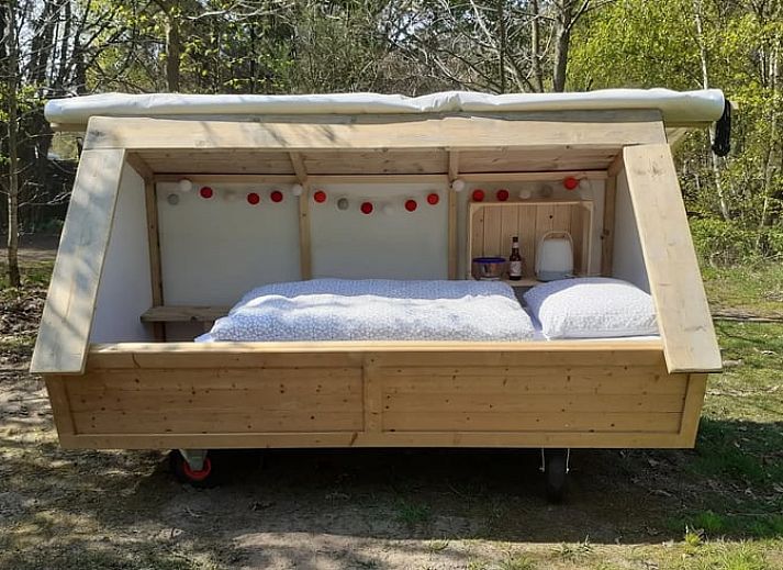Unique wooden bed in Holiday home in Emmen, surrounded by nature in Southeast Drenthe.