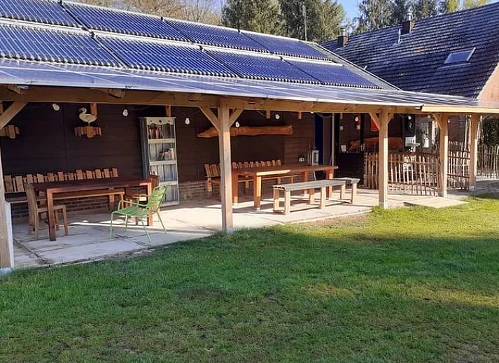 Cozy wooden bed outdoors at Holiday home in Emmen, ideal for nature lovers.