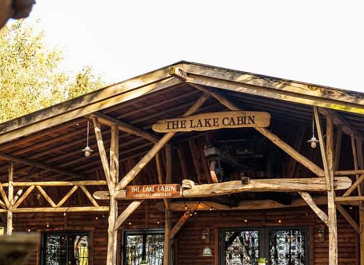 Cottage in Erm, vacation home in Southeast Drenthe with rustic wooden porch surrounded by nature.