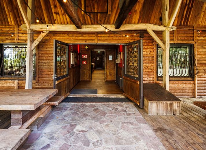 Cottage in Erm, vacation home in Southeast Drenthe with rustic wooden porch surrounded by nature.