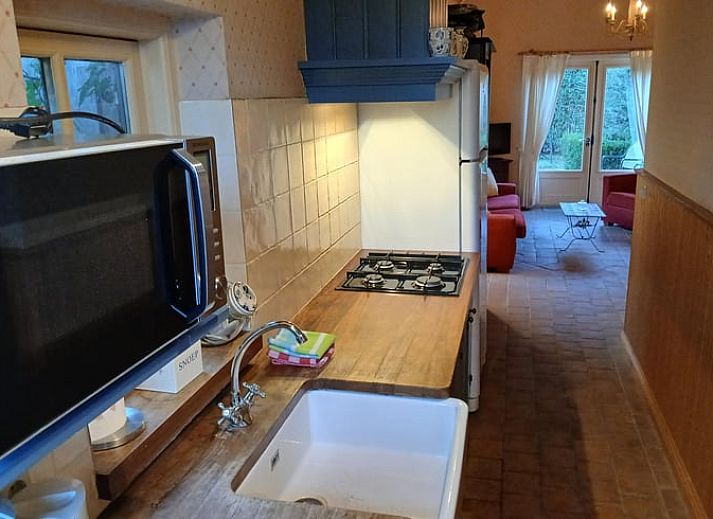 Cozy living room in Holiday Home in Stieltjeskanaal, Southeast Drenthe, with comfortable seating and garden views.