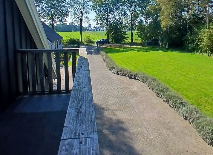 Sunny day at vacation home DG1648 in Second Exloermond with green surroundings.