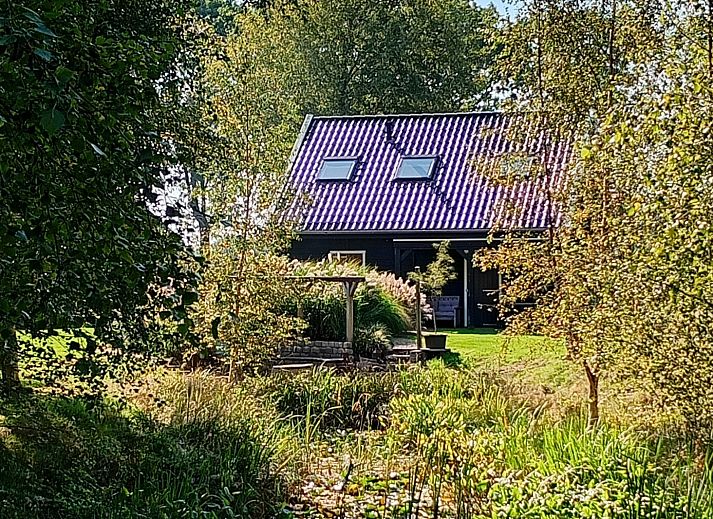 Covered veranda at vacation home DG1648 in Second Exloermond, ideal for relaxation.