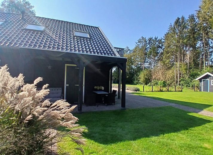 Covered veranda at vacation home DG1648 in Second Exloermond, ideal for relaxation.