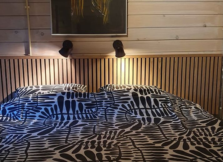 Cozy porch of Holiday Home in 't Haantje, Drenthe, surrounded by flowering shrubs.