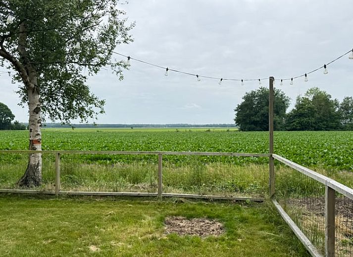 Cozy indoor area of Holiday Home in Odoornerveen, Drenthe, with dining area and modern furnishings for a comfortable stay.