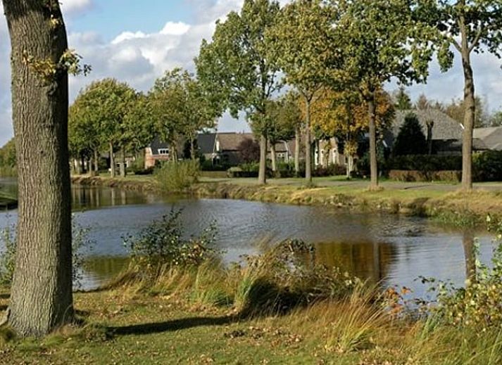 Cozy indoor area of Holiday Home in Odoornerveen, Drenthe, with dining area and modern furnishings for a comfortable stay.