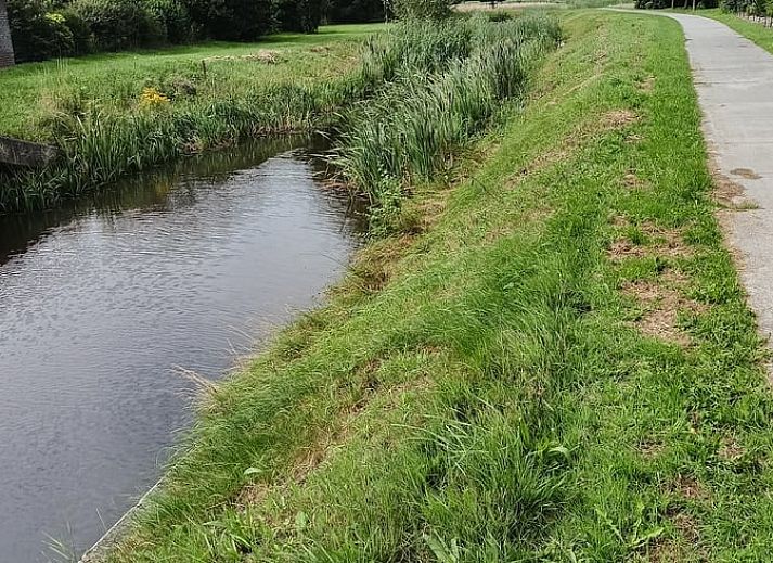 Dining area overlooking garden in Cottage in Emmer-Compascuum, vacation home in Southeast Drenthe, Drenthe.