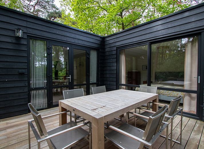 Bright dining room in Holiday home in Doldersum, Southwest Drenthe overlooking green garden, perfect for a relaxing stay in Drenthe.