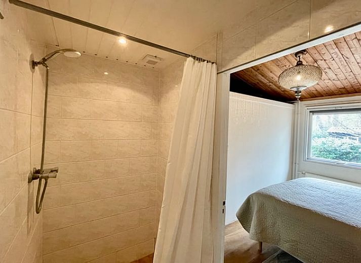 Helles Wohnzimmer mit gemuetlicher Sitzecke im Ferienhaus in Havelte, Suedwest-Drenthe.