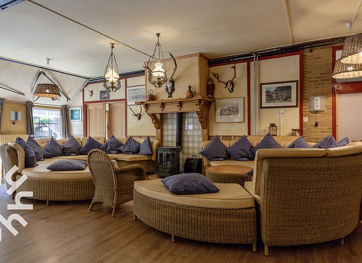 Terrace at DG183 vacation home in Diever, Drenthe, ideal for group dinners.