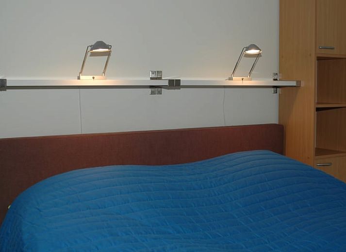 Gezellig vakantiehuis in Diever omgeven door bloeiende struiken in Drenthe.