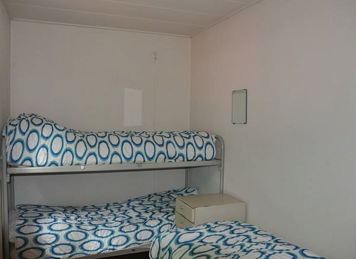 Knusse woonkamer met open haard in Vakantiehuis in Diever, Drenthe.