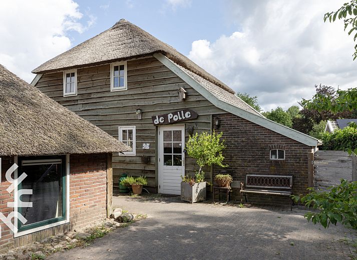 Spielecke im Ferienhaus DG053, Diever mit Spielen und Hochstuhl.